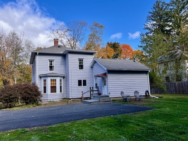 239 Pelham Road Amherst, MA 01002 - Photo 30 of 30 a front view of a house with a yard and garage