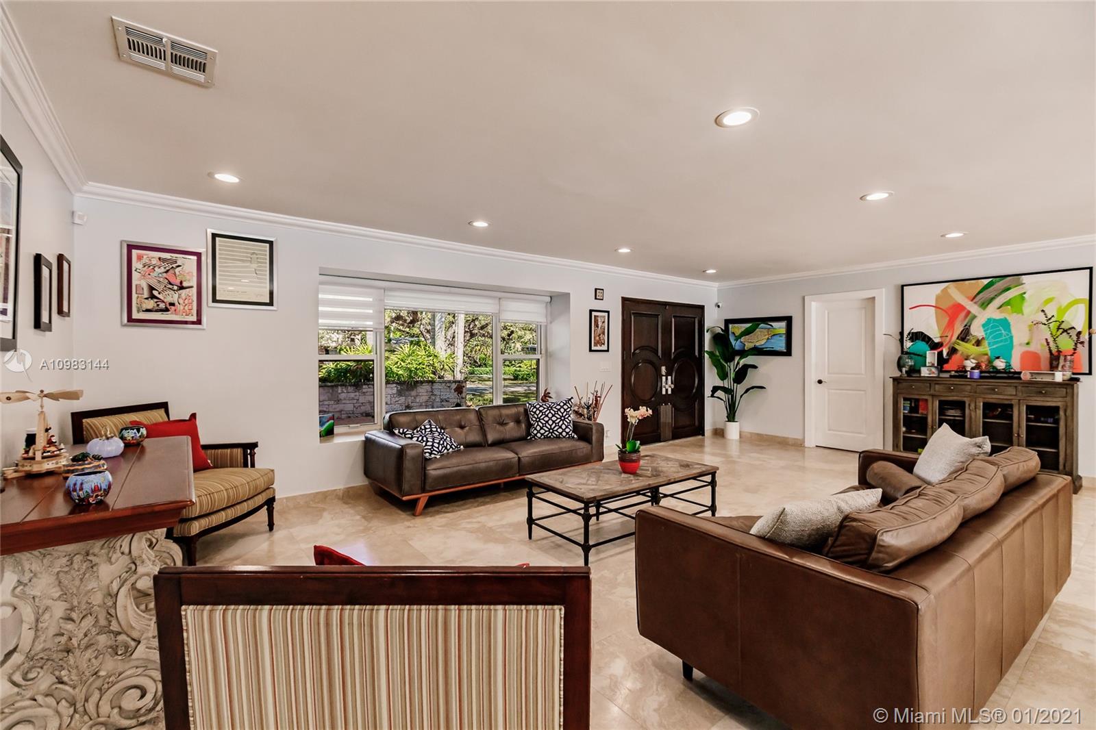 6400 Southwest 134th Drive Pinecrest, FL 33156 - Photo 12 of 50 a living room with furniture and a flat screen tv