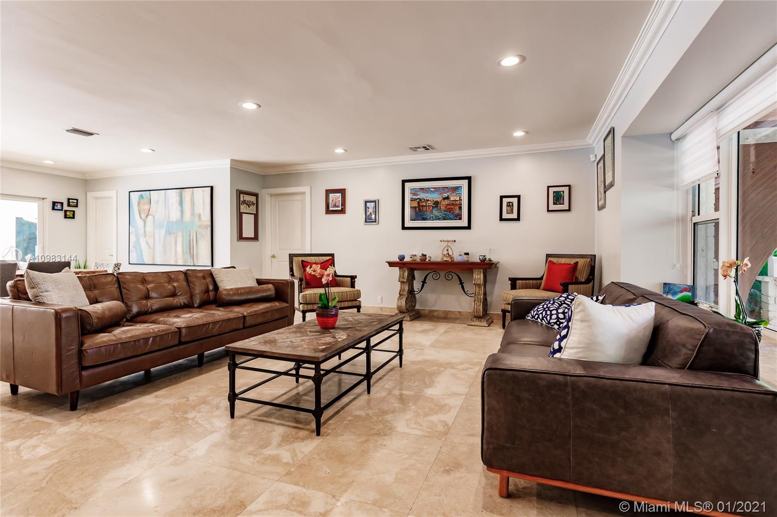 6400 Southwest 134th Drive Pinecrest, FL 33156 - Photo 13 of 50 a living room with furniture and a large window