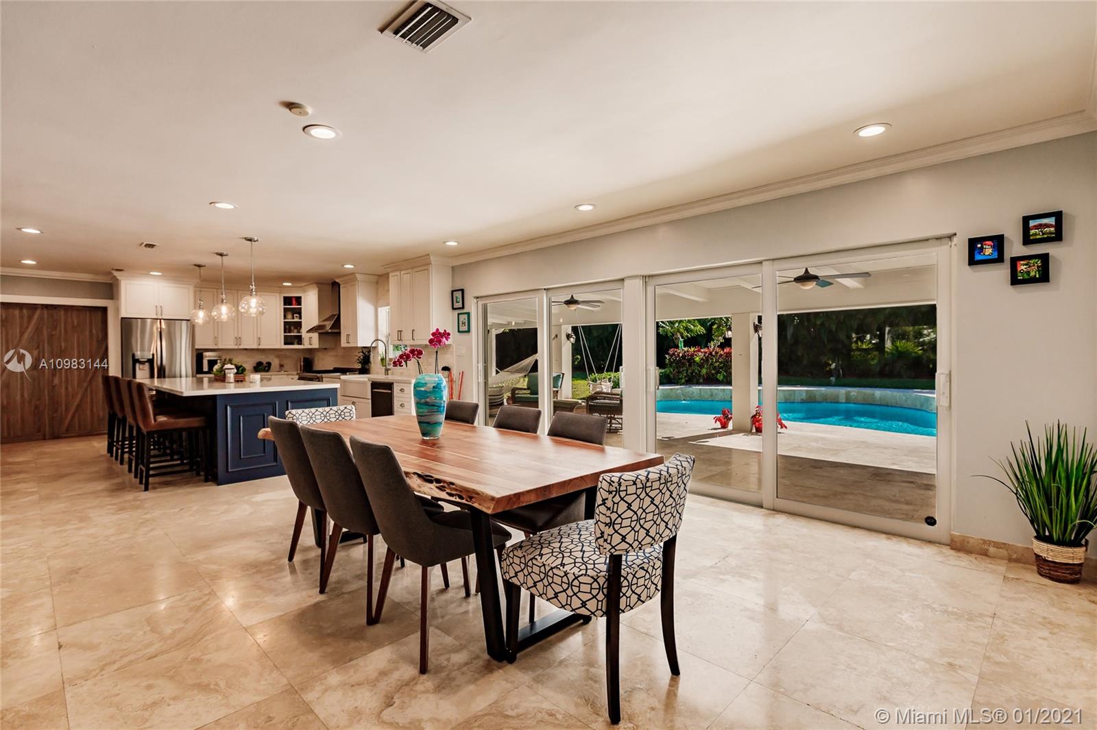 6400 Southwest 134th Drive Pinecrest, FL 33156 - Photo 14 of 50 a outdoor dining space with furniture and kitchen view