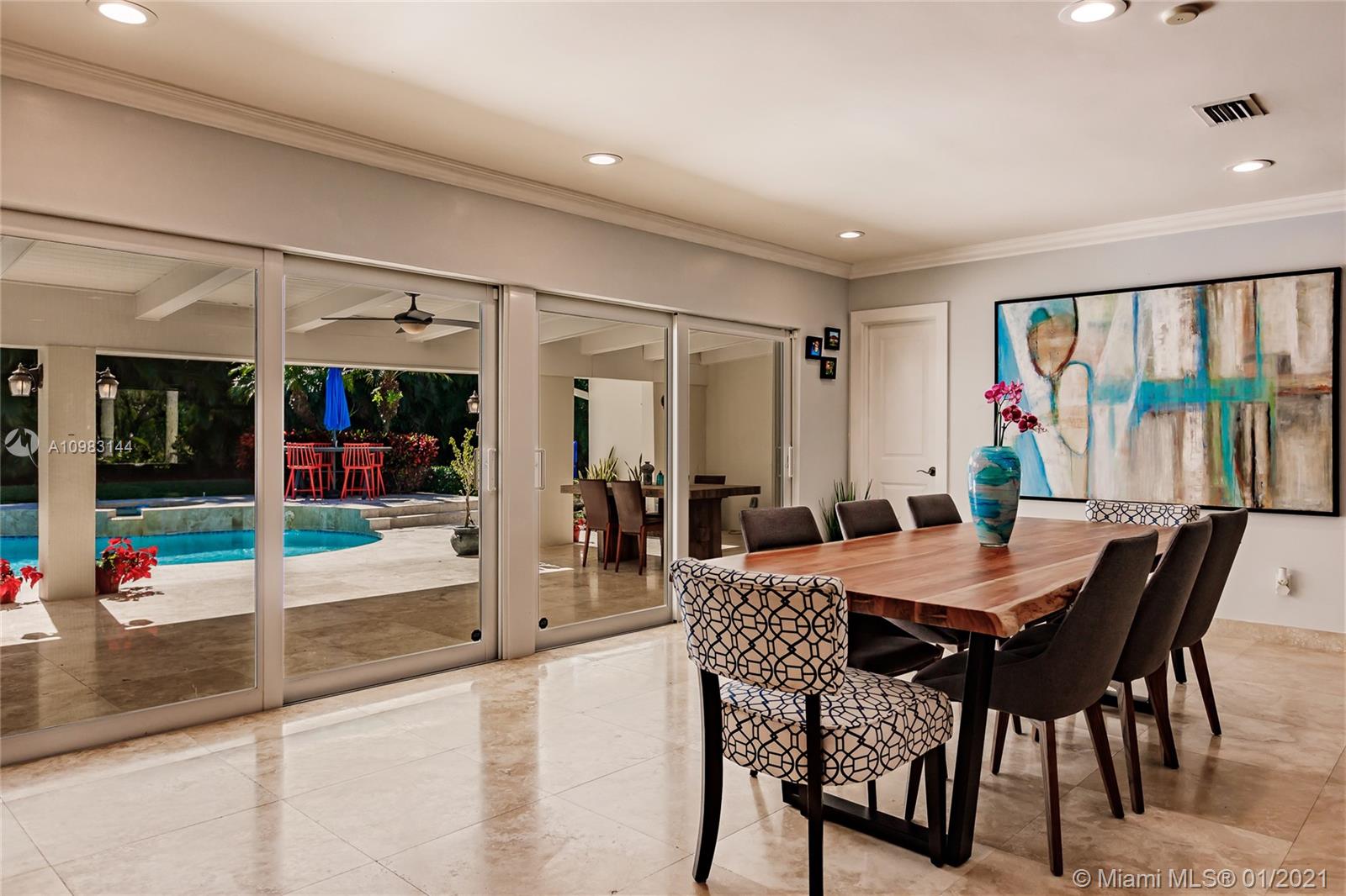 6400 Southwest 134th Drive Pinecrest, FL 33156 - Photo 15 of 50 a view of a dining room with furniture window and wooden floor
