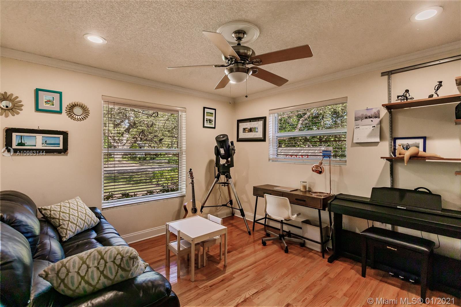6400 Southwest 134th Drive Pinecrest, FL 33156 - Photo 26 of 50 a living room with furniture and a window