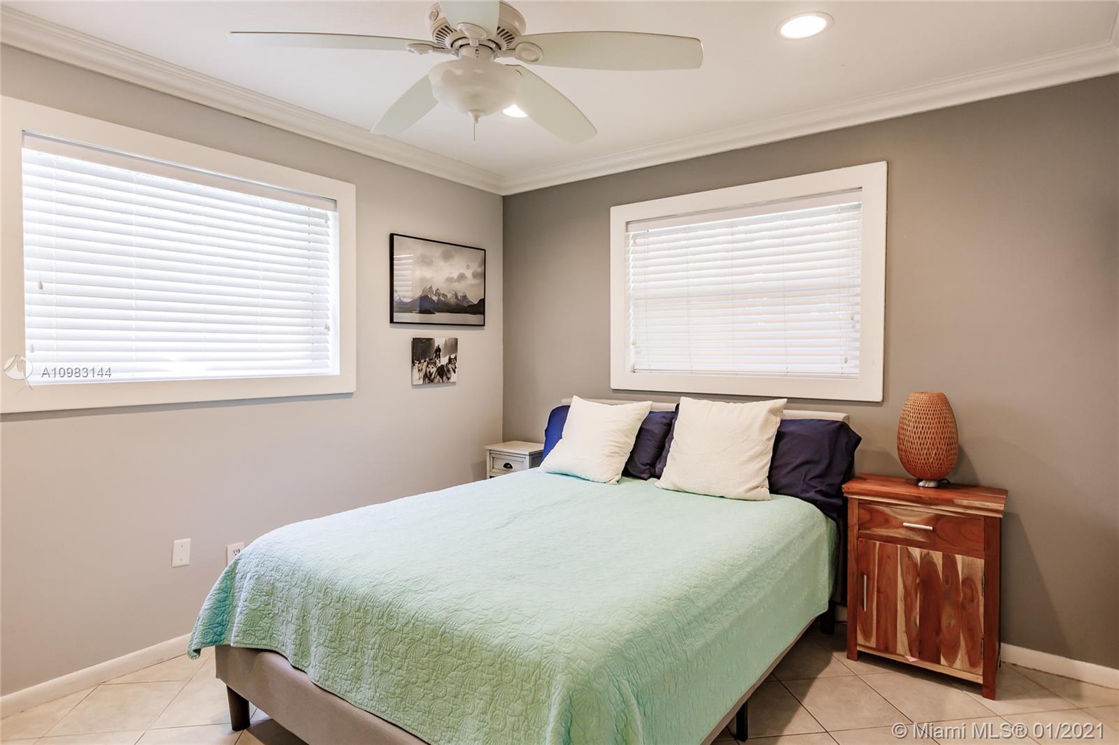 6400 Southwest 134th Drive Pinecrest, FL 33156 - Photo 28 of 50 a bedroom with bed and window