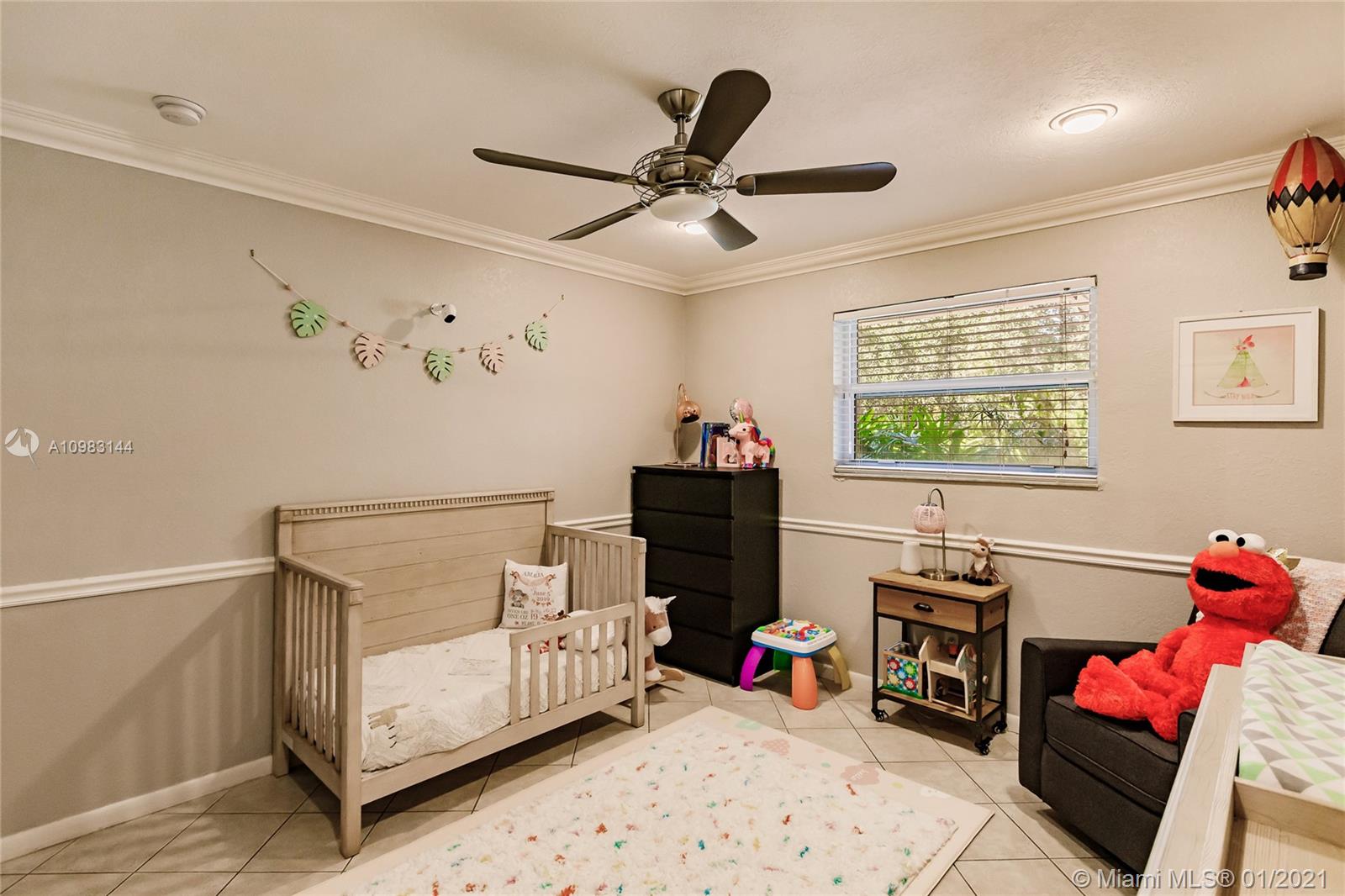 6400 Southwest 134th Drive Pinecrest, FL 33156 - Photo 32 of 50 a bedroom with furniture and a window
