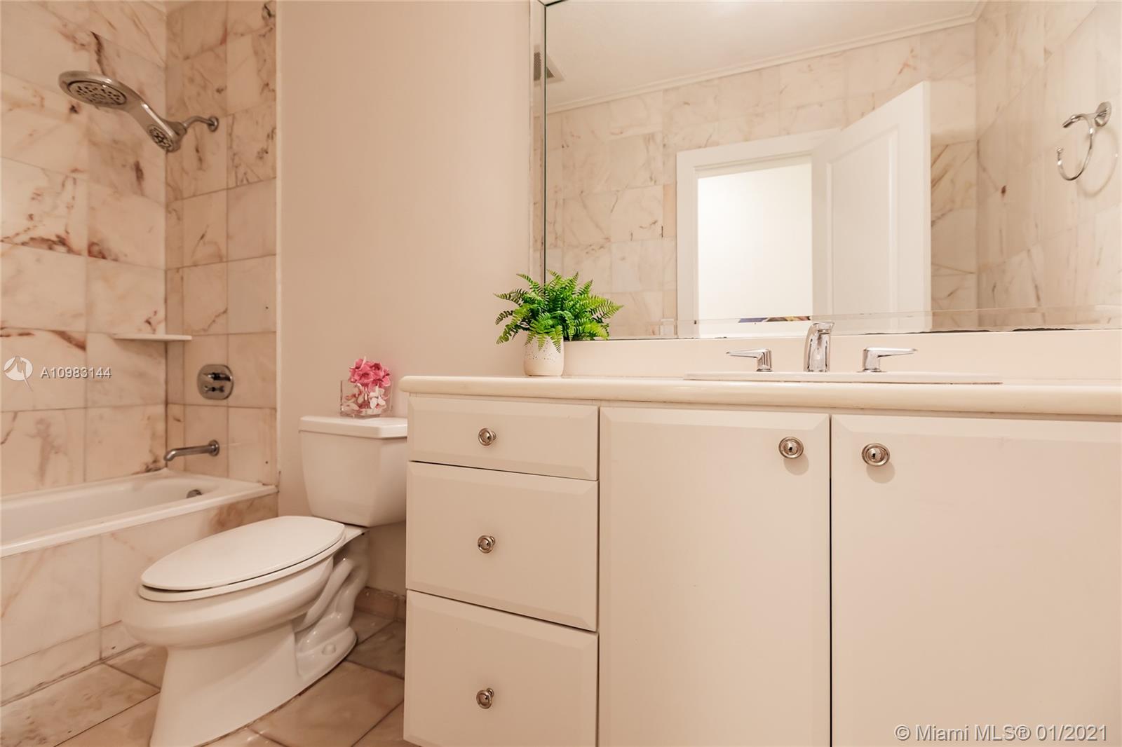 6400 Southwest 134th Drive Pinecrest, FL 33156 - Photo 39 of 50 a bathroom with a sink a toilet and shower