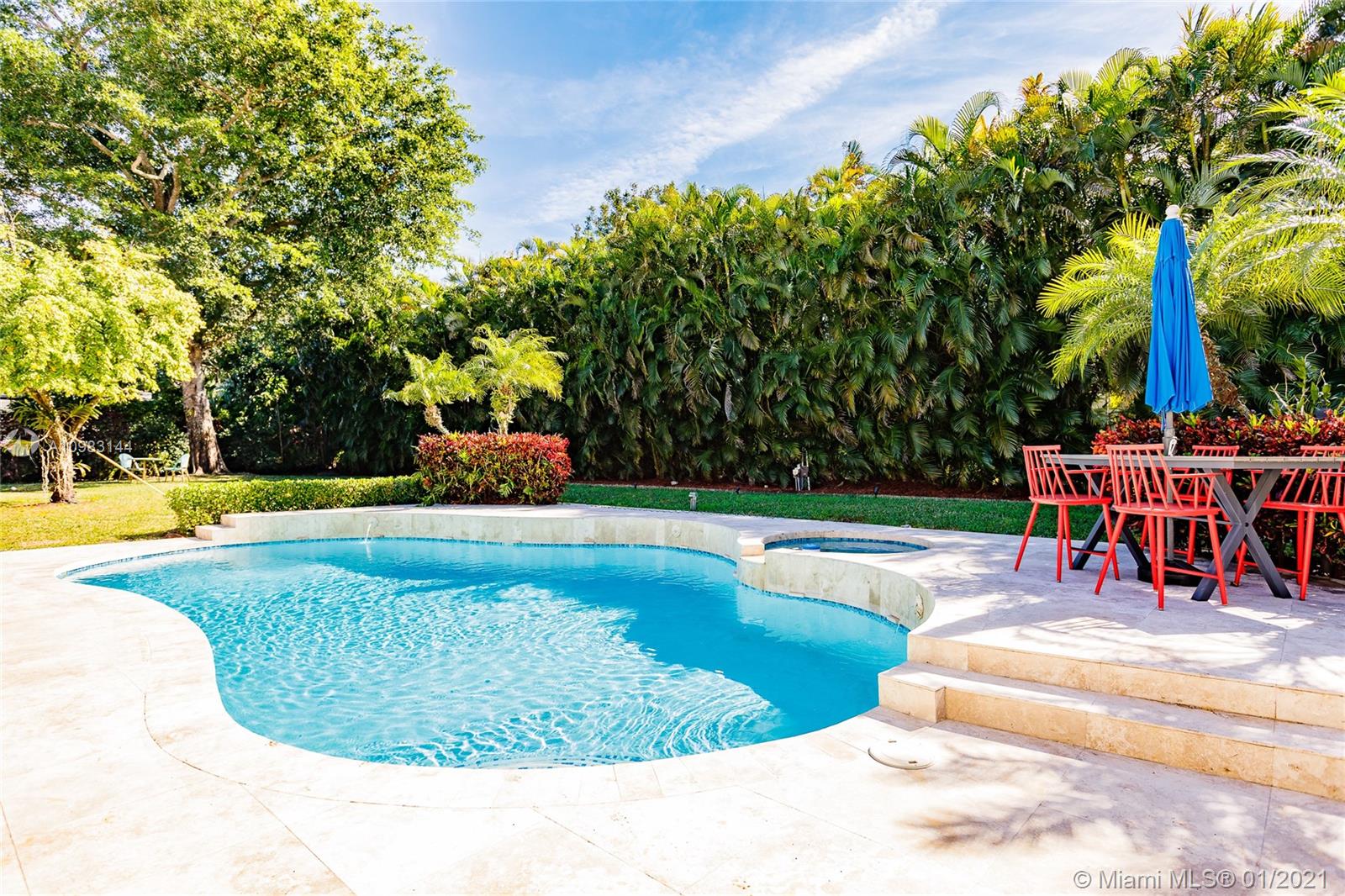 6400 Southwest 134th Drive Pinecrest, FL 33156 - Photo 43 of 50 a view of a swimming pool with a sitting space