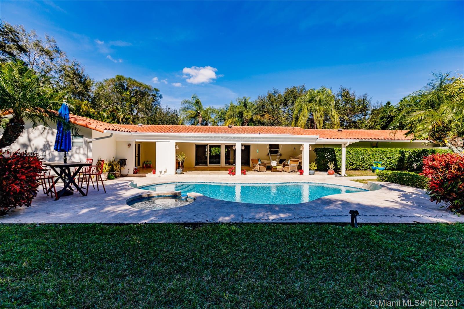 6400 Southwest 134th Drive Pinecrest, FL 33156 - Photo 45 of 50 a view of house with swimming pool yard and outdoor seating