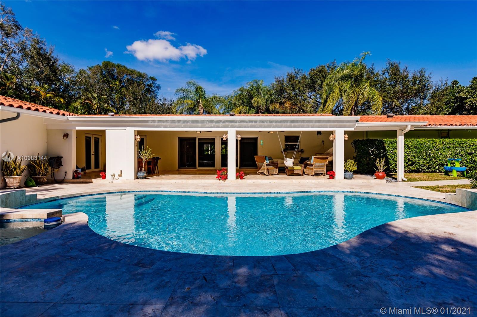 6400 Southwest 134th Drive Pinecrest, FL 33156 - Photo 49 of 50 a view of a house with a swimming pool and sitting area