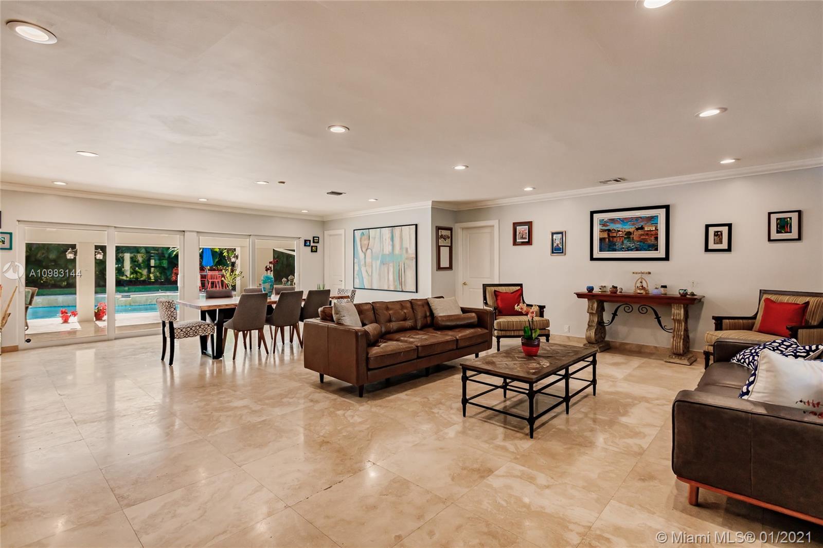 6400 Southwest 134th Drive Pinecrest, FL 33156 - Photo 6 of 50 a living room with furniture and a flat screen tv