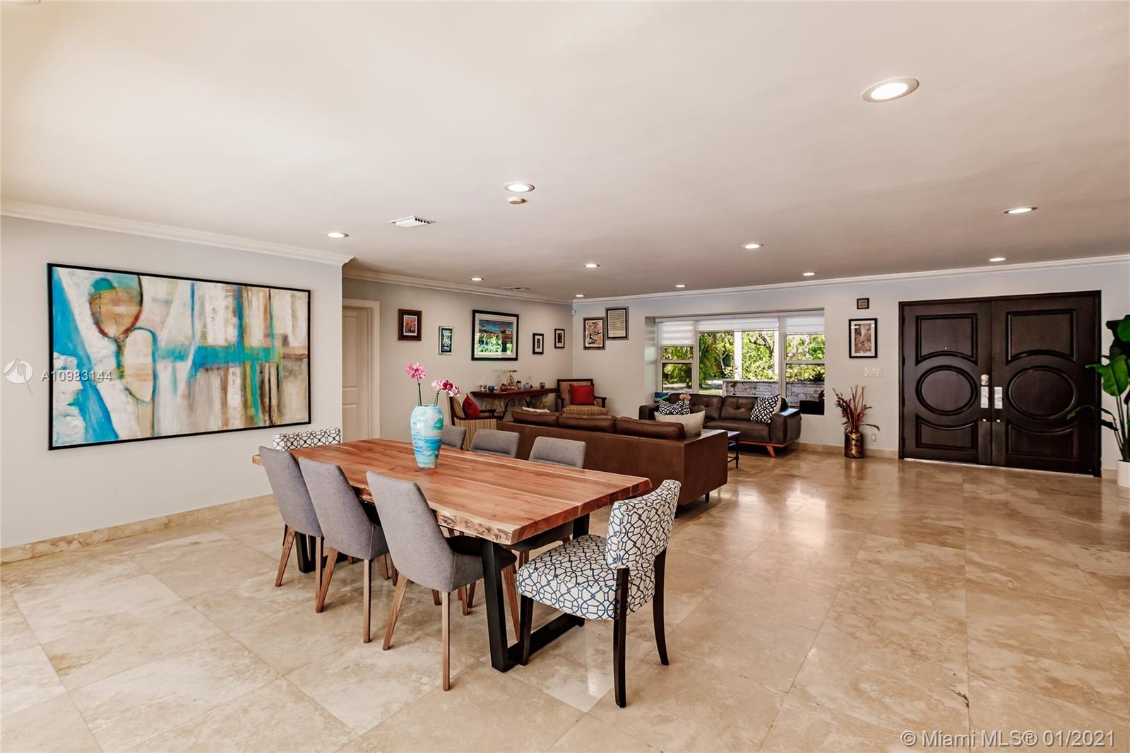 6400 Southwest 134th Drive Pinecrest, FL 33156 - Photo 9 of 50 a living room with furniture a window and a table