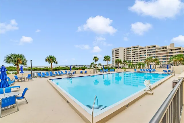 a view of a chairs and table in patio