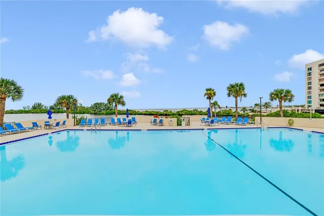 a view of swimming pool with outdoor seating
