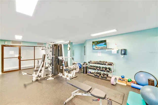a room with furniture pool table and windows