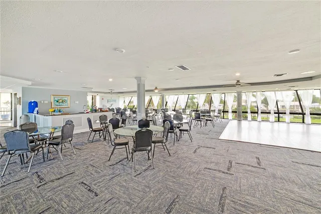a view of a patio with a table and chairs