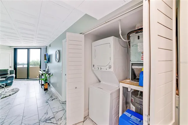 a living room with furniture and a book shelf