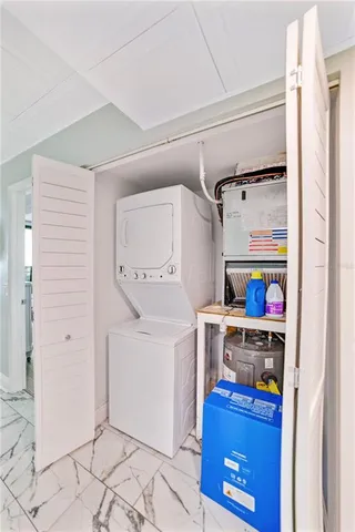 a kitchen with a refrigerator and cabinets
