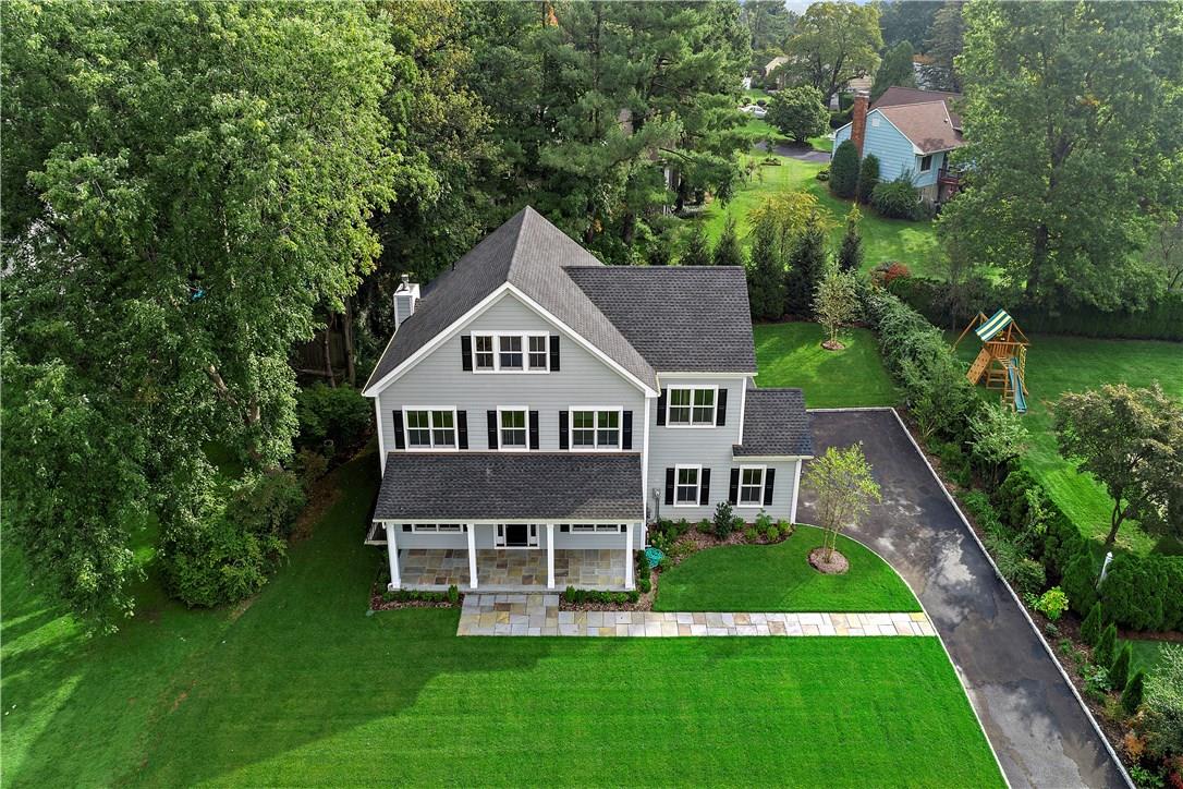 21 Elm Hill Drive Rye Brook, NY 10573 - Photo 1 of 1 a aerial view of a house with a big yard plants and large trees
