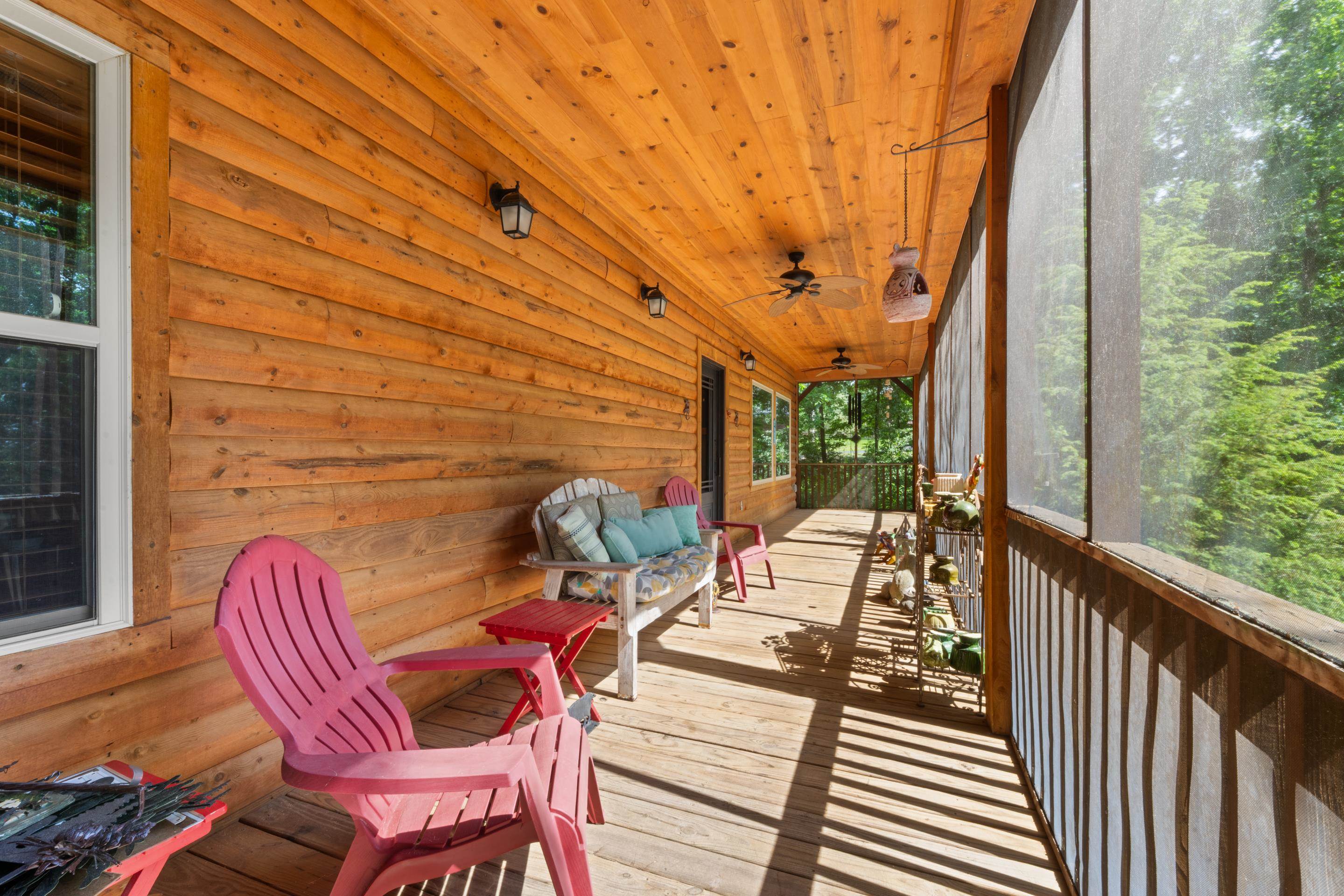 950 Cherry Road Eads, TN 38028 - Photo 24 of 30 Expansive screened porch featuring wood-finish flooring, a planked wood ceiling, and exposed wood siding