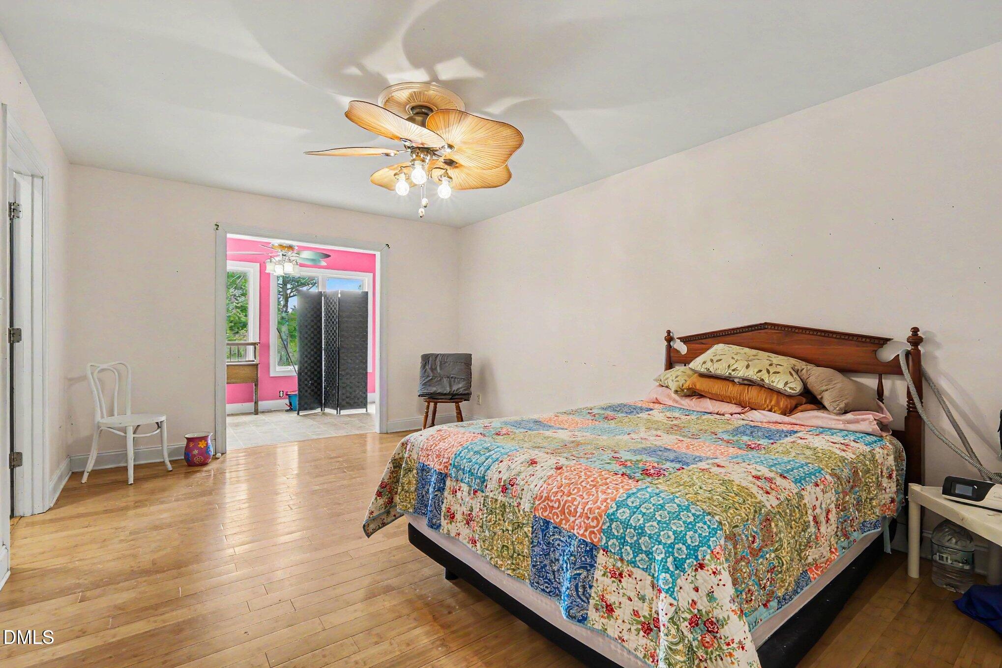 1750 Tom Oakley Road Timberlake, NC 27583 - Photo 15 of 31 a bedroom with a bed and ceiling fan