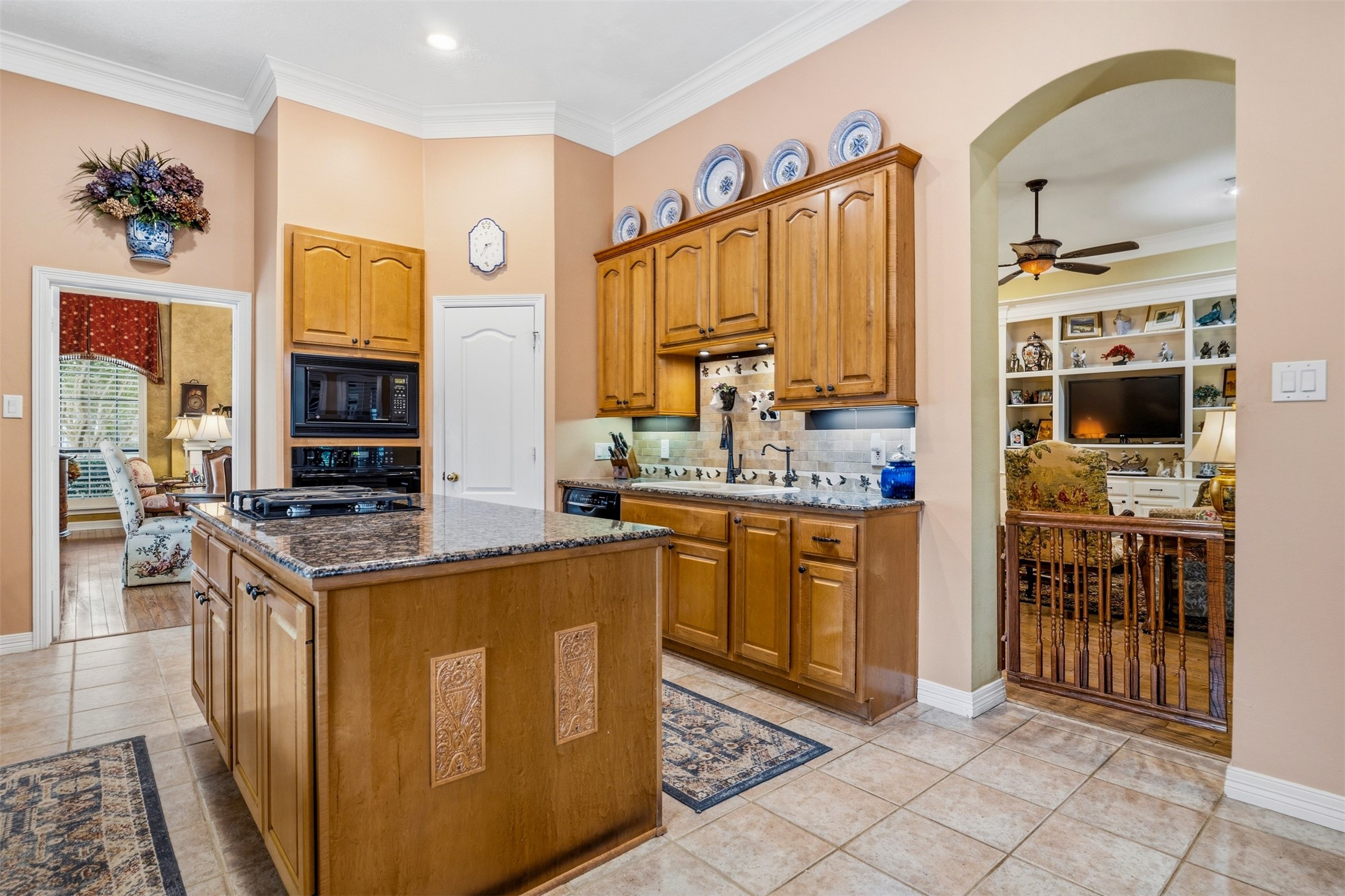 12215 Pebble Meadows Houston, TX 77041 - Photo 13 of 44 Another view of the kitchen with matching black appliances and a walk in pantry.