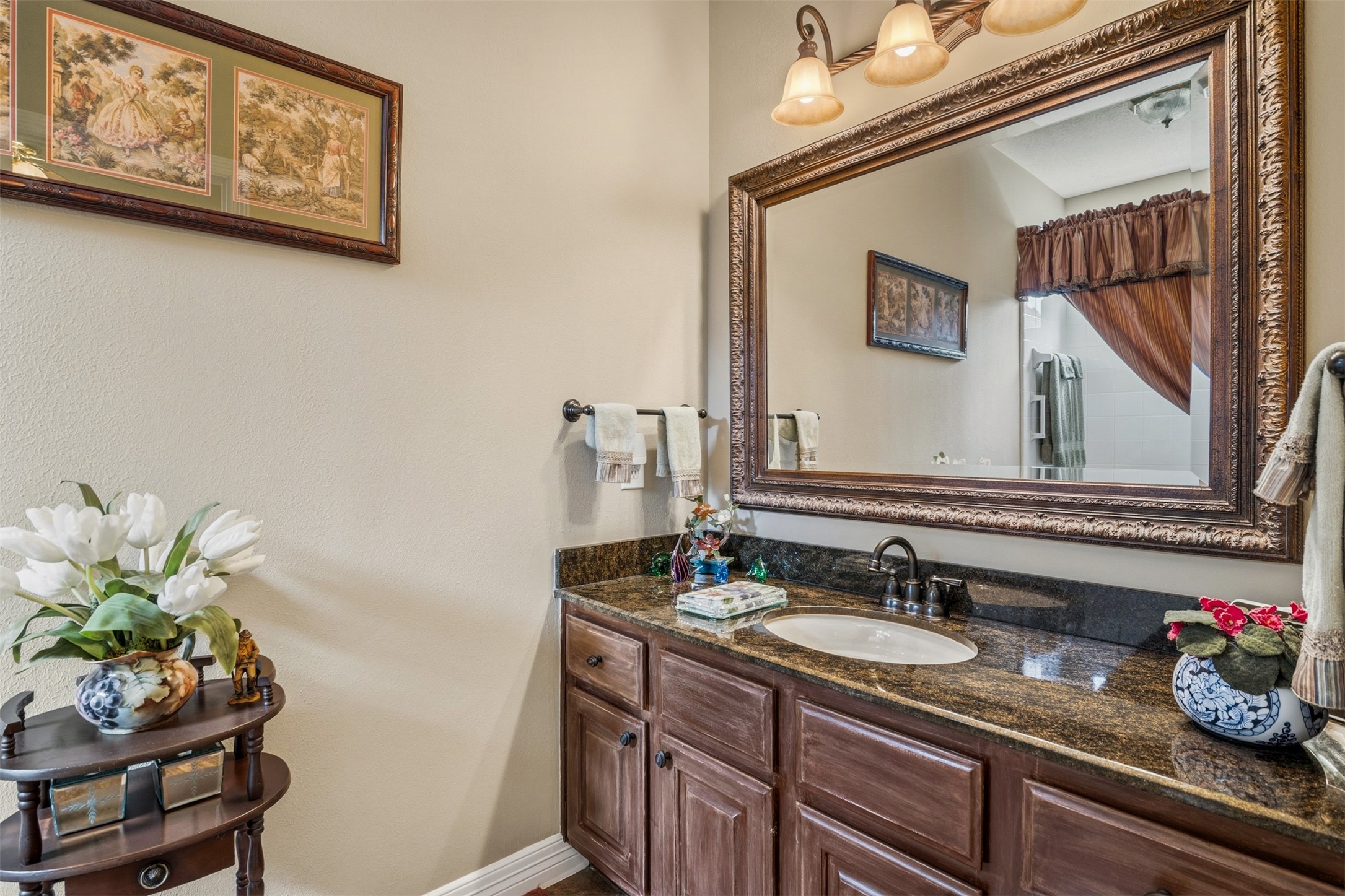 12215 Pebble Meadows Houston, TX 77041 - Photo 21 of 44 En suite full bathroom includes single sink vanity with granite countertop and a tub/shower combo.