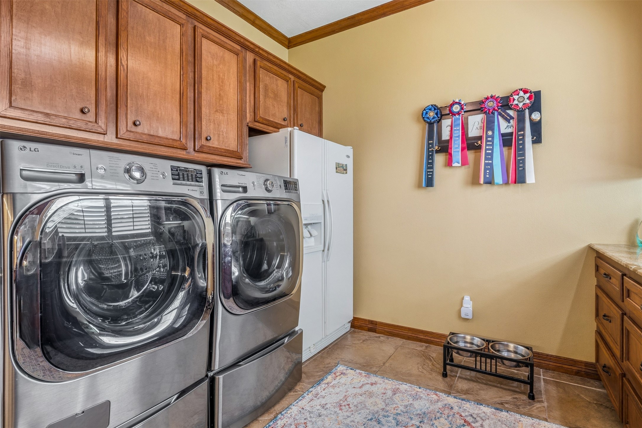 12215 Pebble Meadows Houston, TX 77041 - Photo 25 of 44 The oversized utility room has built in cabinets and a space for a secondary refrigerator.