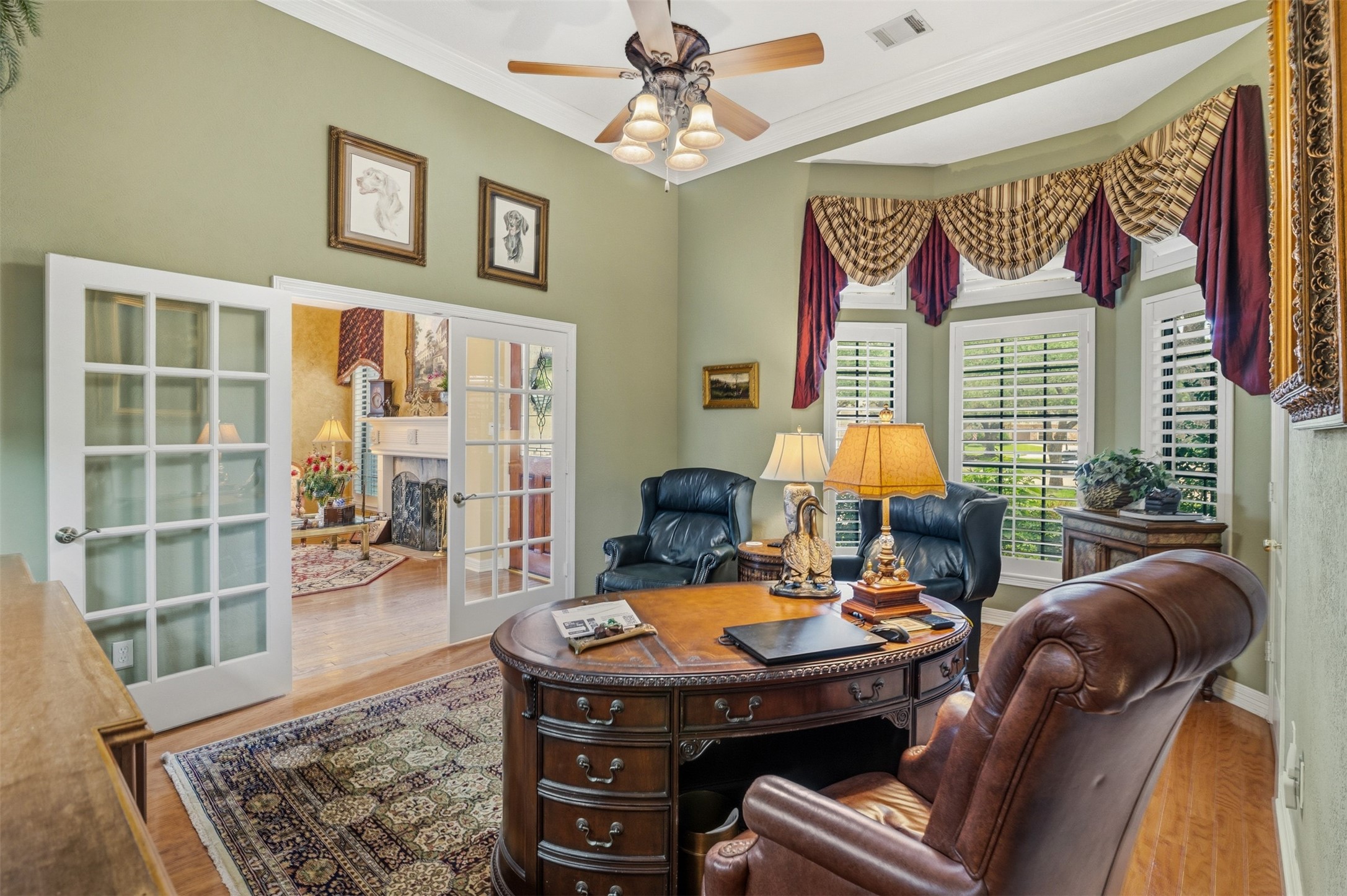 12215 Pebble Meadows Houston, TX 77041 - Photo 3 of 44 The study has large double french doors, crown molding, ceiling fan and wood floors.
