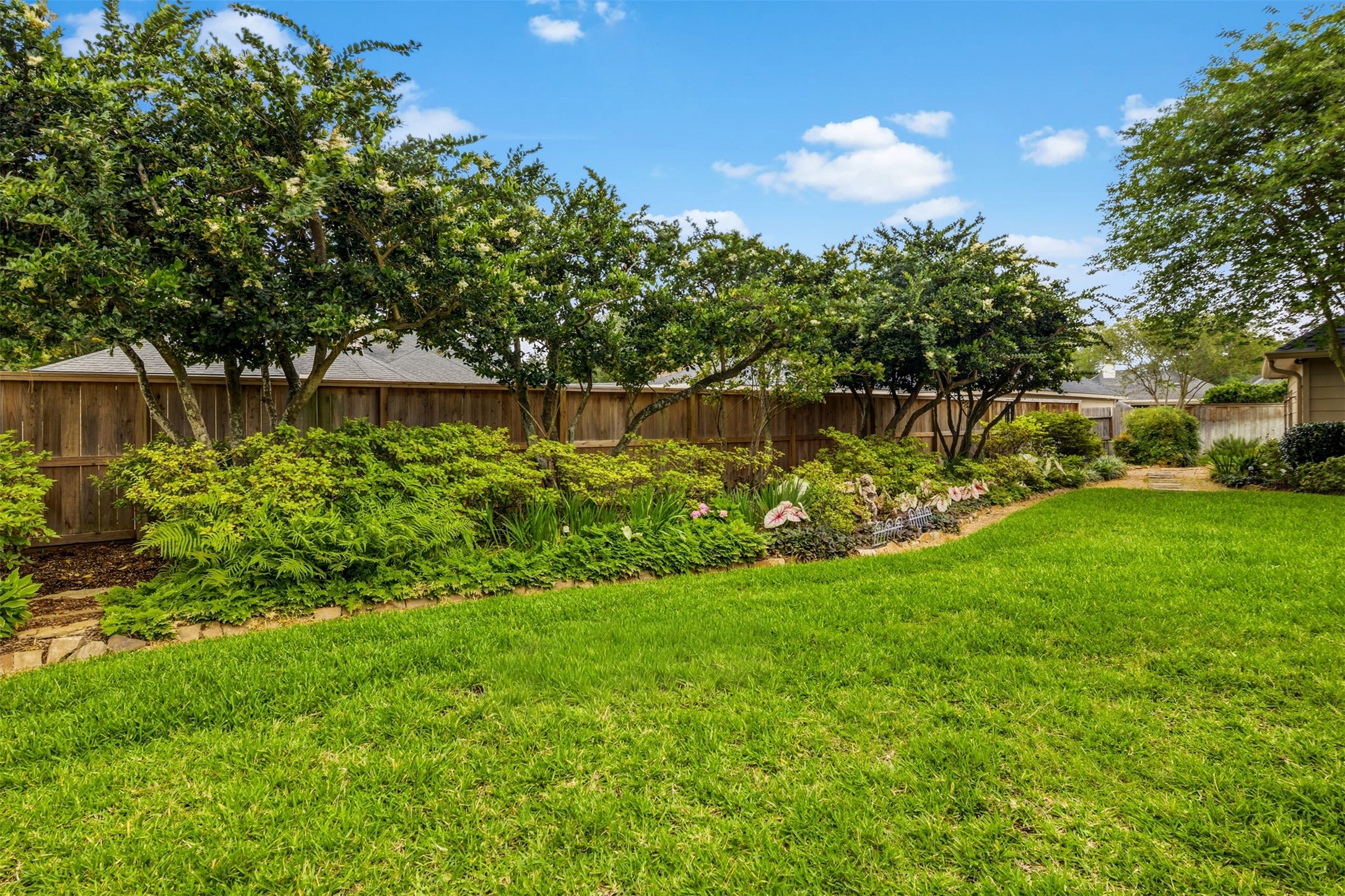 12215 Pebble Meadows Houston, TX 77041 - Photo 32 of 44 The back and front yards have professional landscaping throughout.