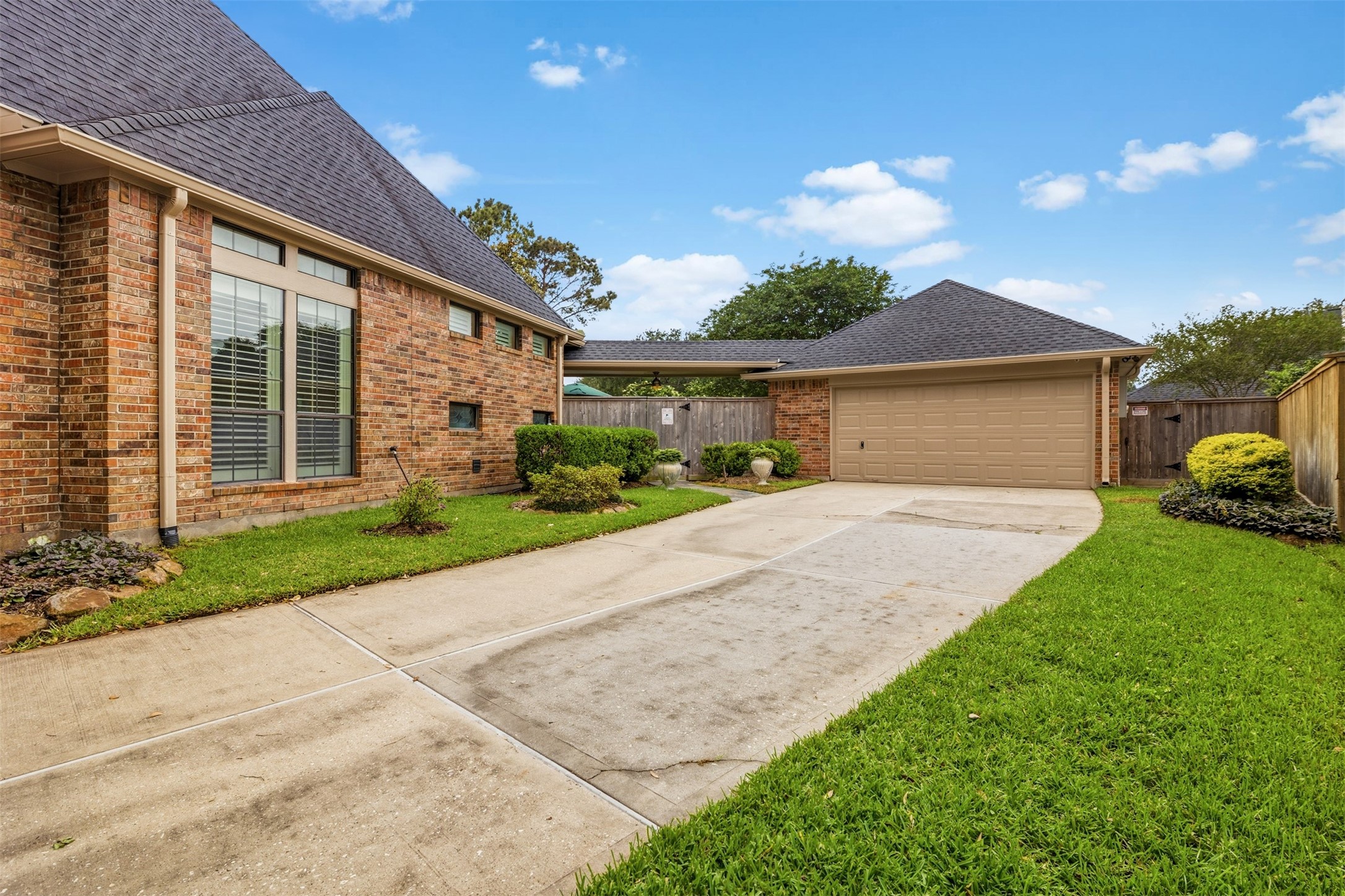 12215 Pebble Meadows Houston, TX 77041 - Photo 35 of 44 Home has a long driveway and 2 car detached garage. The garage has A/C and office or storage space.