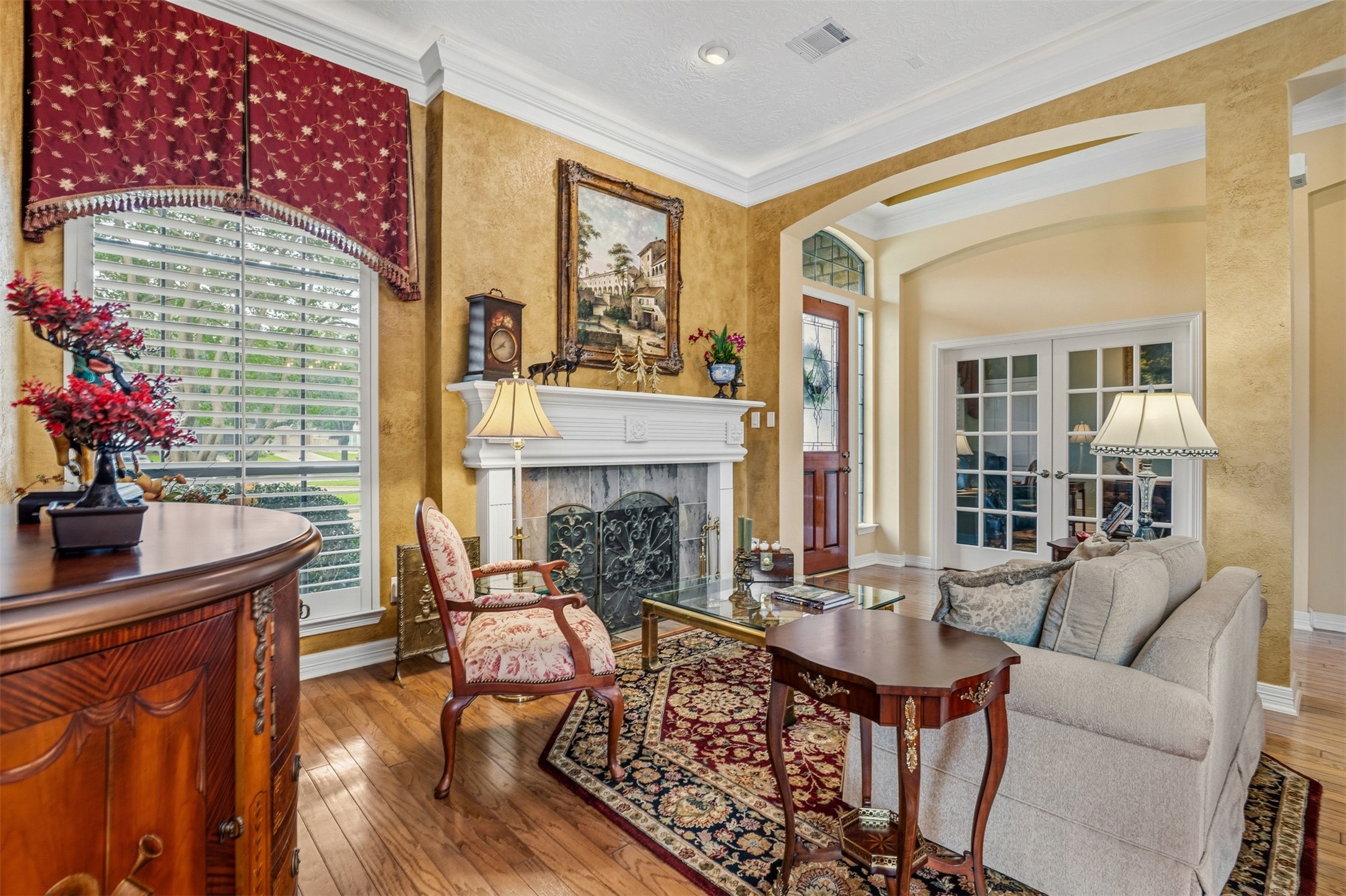 12215 Pebble Meadows Houston, TX 77041 - Photo 5 of 44 The formal living room is just off the front entry and features a stone fireplace and crown molding.