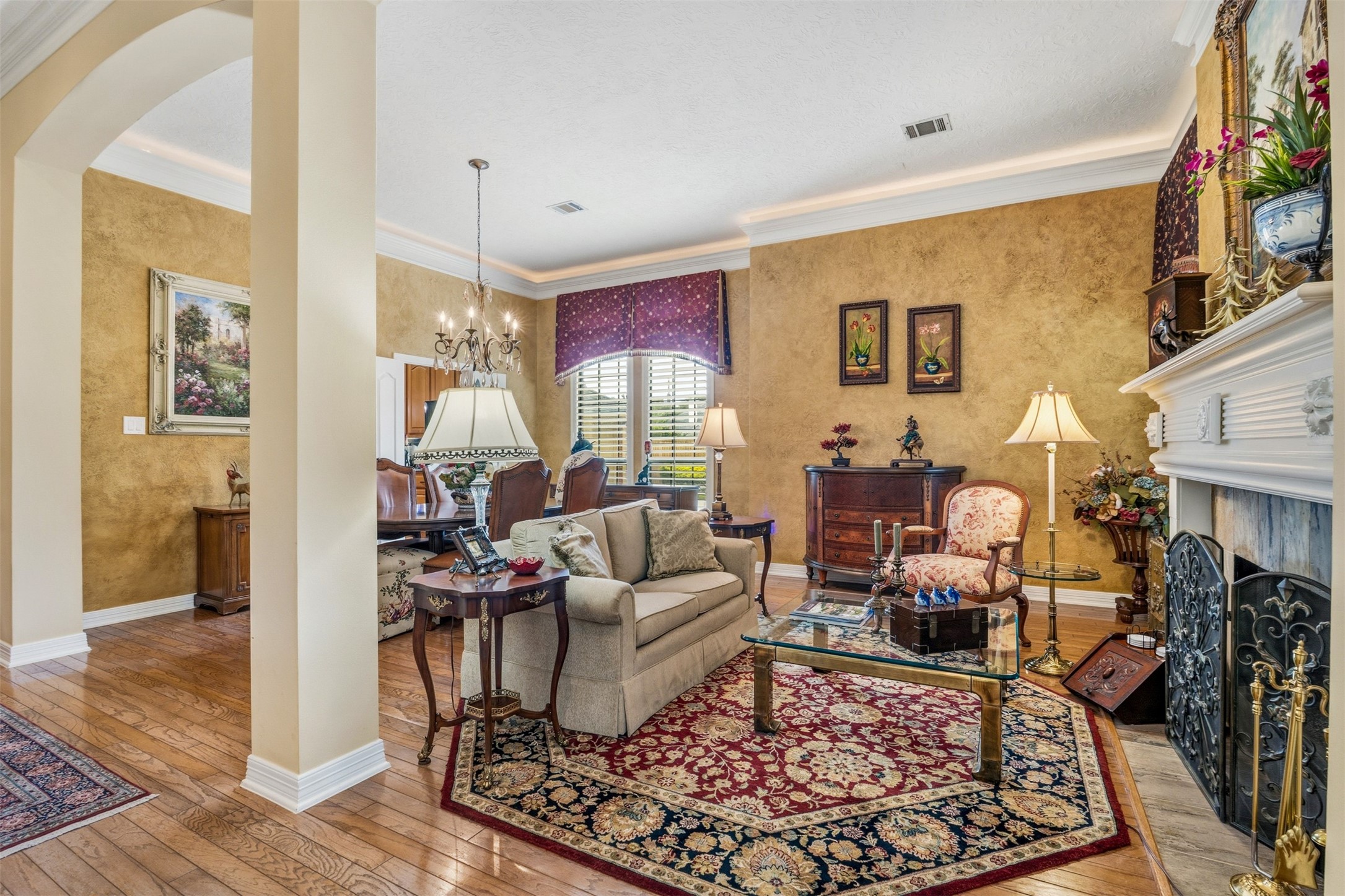 12215 Pebble Meadows Houston, TX 77041 - Photo 6 of 44 View of the formal living room and dining room with wood floors and cove lighting.