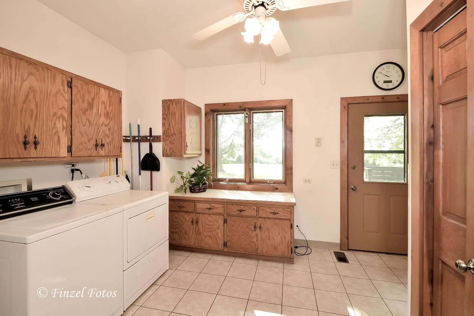 20619 Dunham Road Marengo, IL 60152 - Photo 19 of 31 a room with a washing machine and cabinets