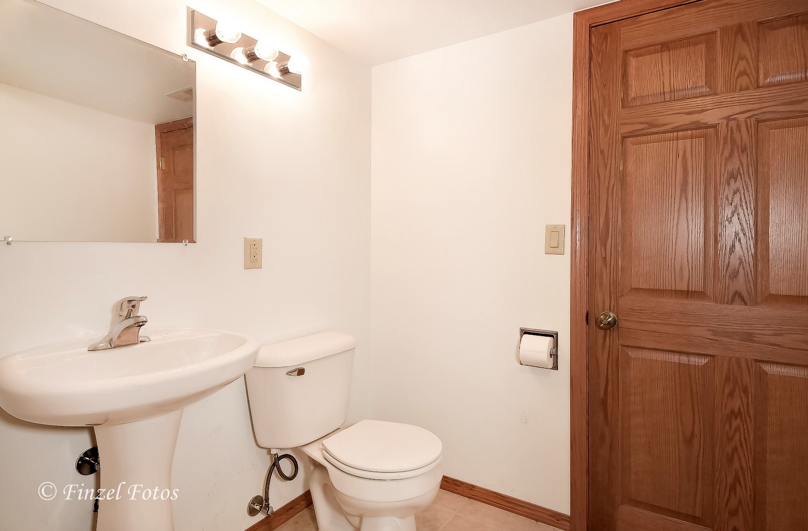 20619 Dunham Road Marengo, IL 60152 - Photo 20 of 31 a bathroom with a sink a toilet and mirror