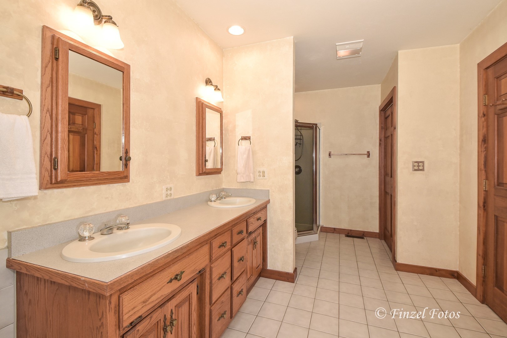 20619 Dunham Road Marengo, IL 60152 - Photo 10 of 31 a bathroom with a sink a mirror and a shower