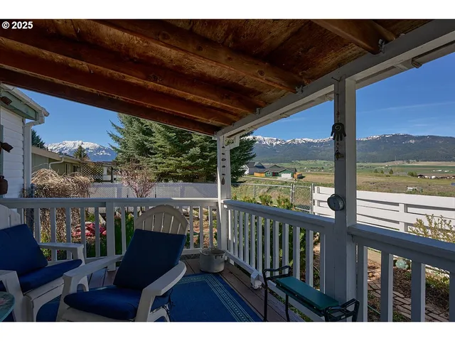 a view of a chairs and table in the balcony