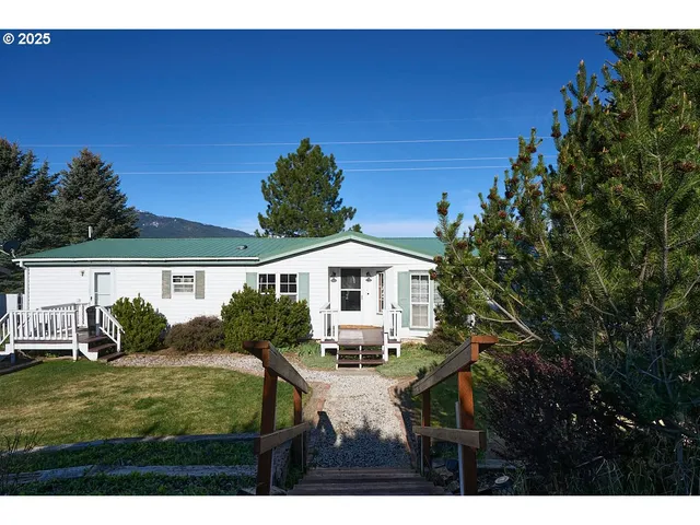 a view of house with yard