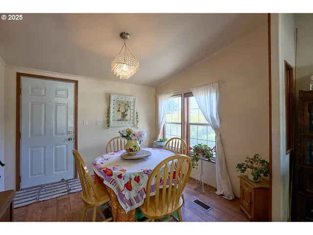 a view of a dining room with furniture window and outside view