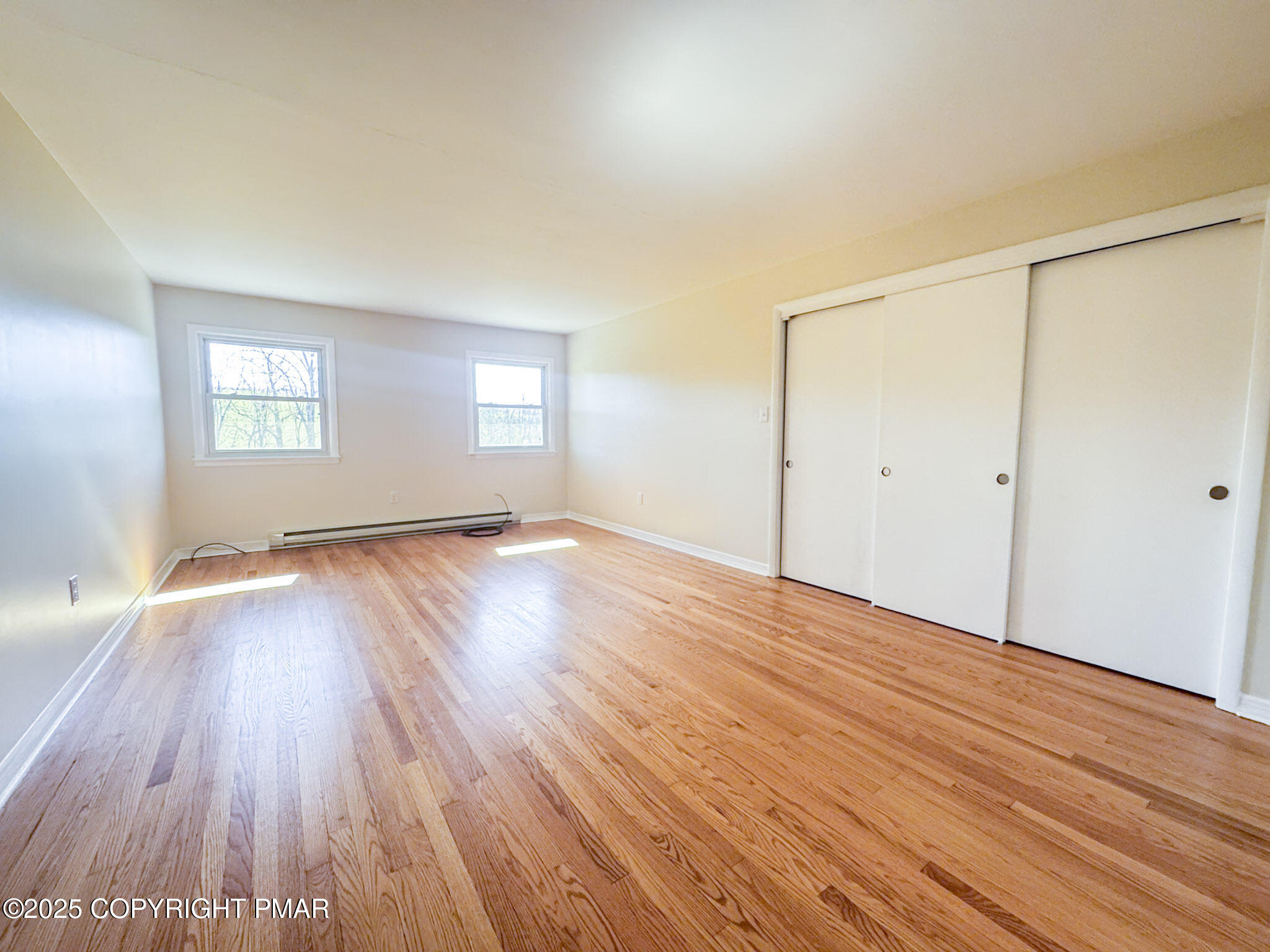 1350 Kunkletown Road Saylorsburg, PA 18353 - Photo 12 of 15 an empty room with wooden floor and windows