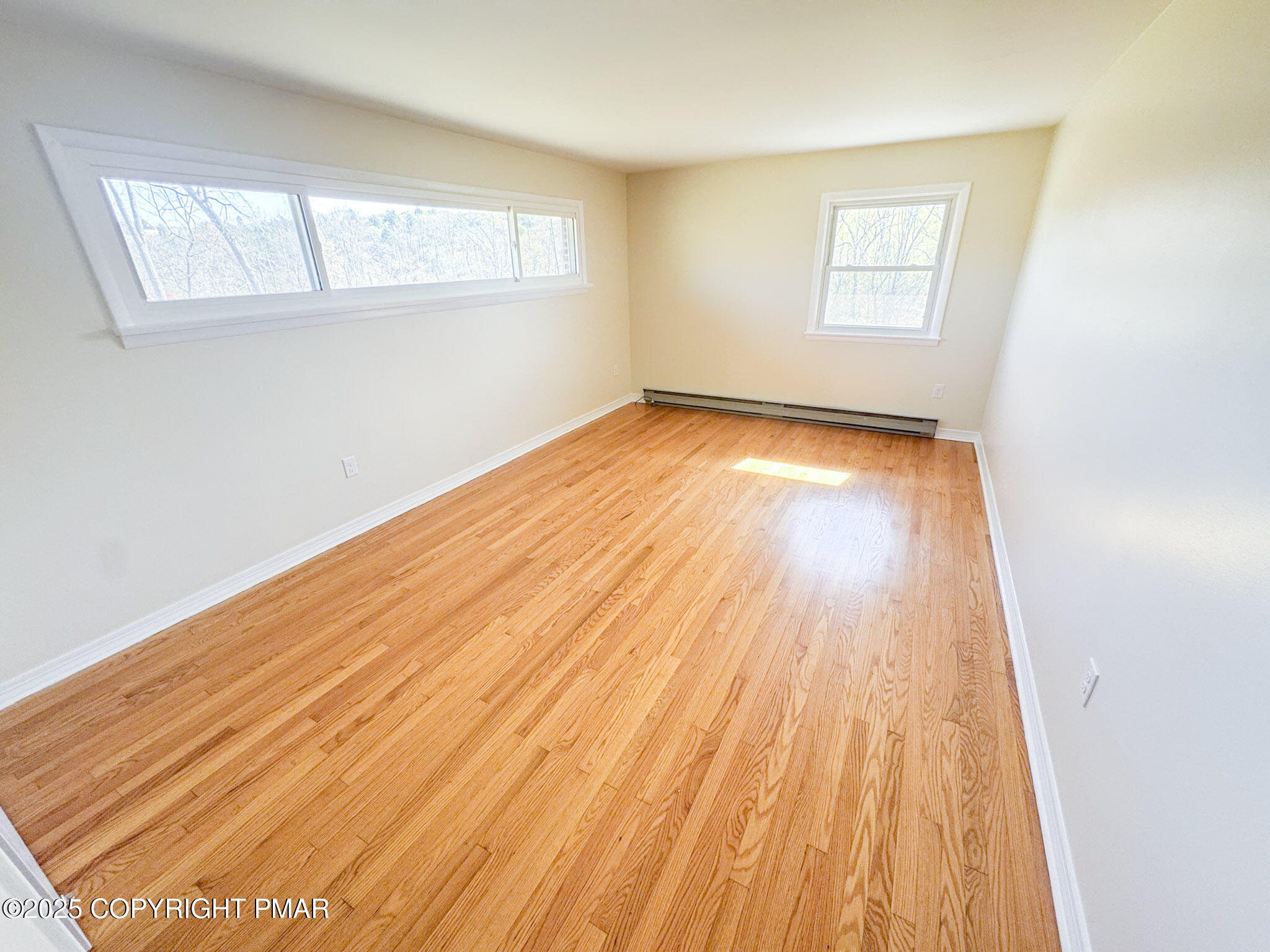 1350 Kunkletown Road Saylorsburg, PA 18353 - Photo 9 of 15 an empty room with wooden floor and windows