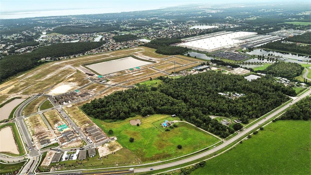 2481 Ham Brown Road Kissimmee, FL 34746 - Photo 11 of 28 an aerial view of residential houses with outdoor space