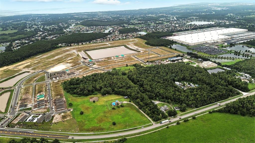 2481 Ham Brown Road Kissimmee, FL 34746 - Photo 13 of 28 an aerial view of residential houses with outdoor space
