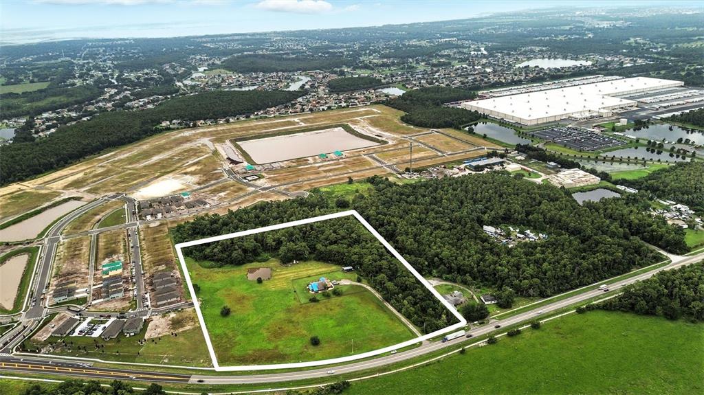 2481 Ham Brown Road Kissimmee, FL 34746 - Photo 14 of 28 an aerial view of a residential houses with outdoor space and trees