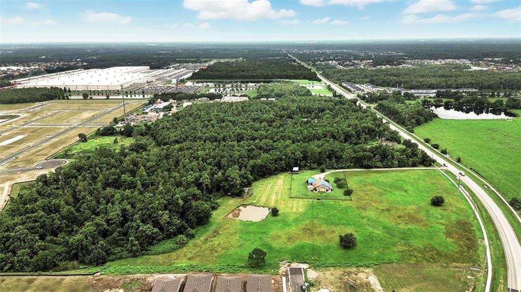 2481 Ham Brown Road Kissimmee, FL 34746 - Photo 17 of 28 an aerial view of residential houses with yard