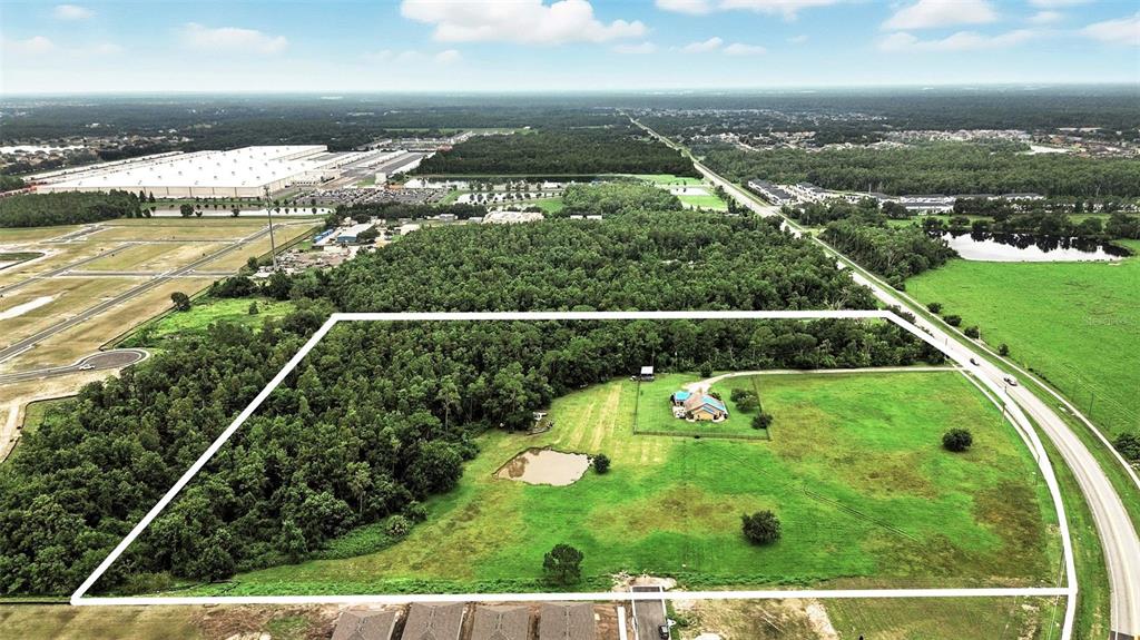 2481 Ham Brown Road Kissimmee, FL 34746 - Photo 18 of 28 an aerial view of residential houses with outdoor space