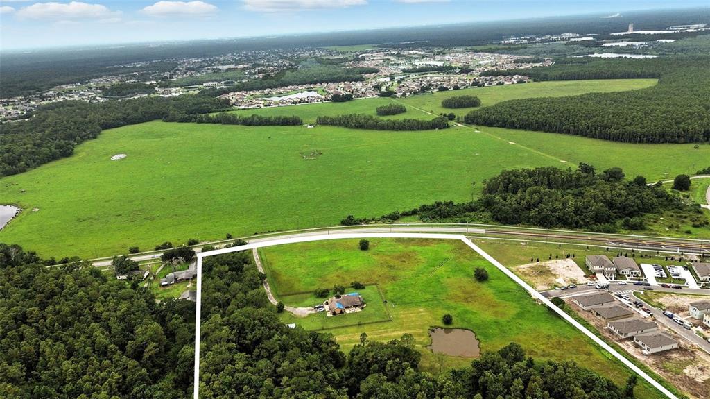 2481 Ham Brown Road Kissimmee, FL 34746 - Photo 24 of 28 a view of a swimming pool and a lake