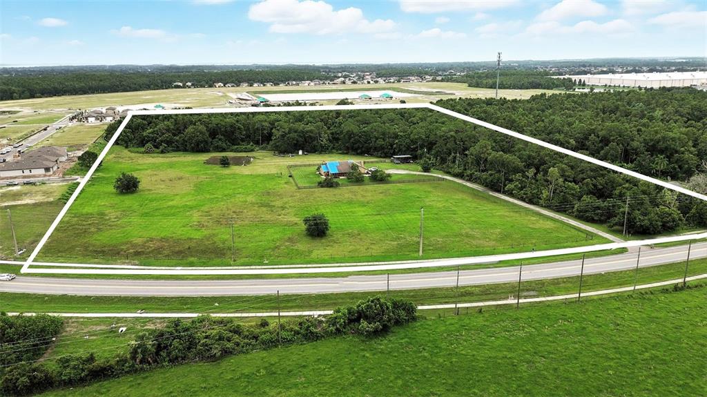 2481 Ham Brown Road Kissimmee, FL 34746 - Photo 4 of 28 a view of a swimming pool with a yard