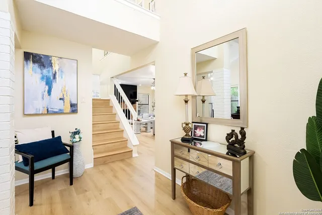 a bedroom with two beds and a flat screen tv