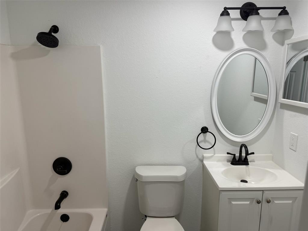 89 West Imogene Street Arcadia, FL 34266 - Photo 12 of 18 a bathroom with a sink and a toilet