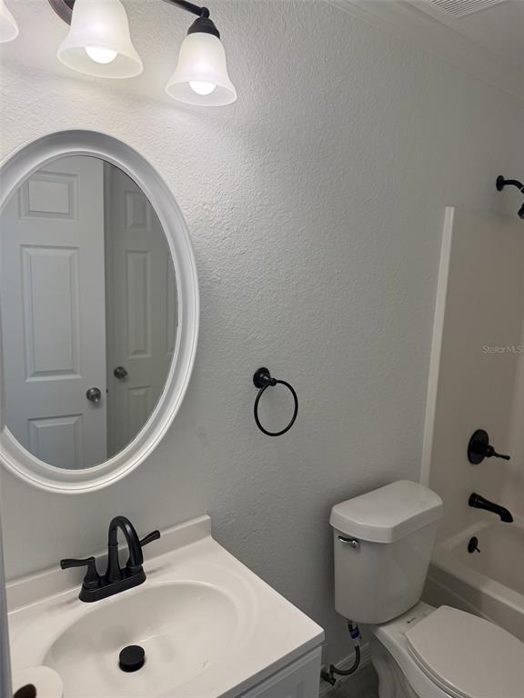 89 West Imogene Street Arcadia, FL 34266 - Photo 15 of 18 a bathroom with a sink mirror vanity and toilet