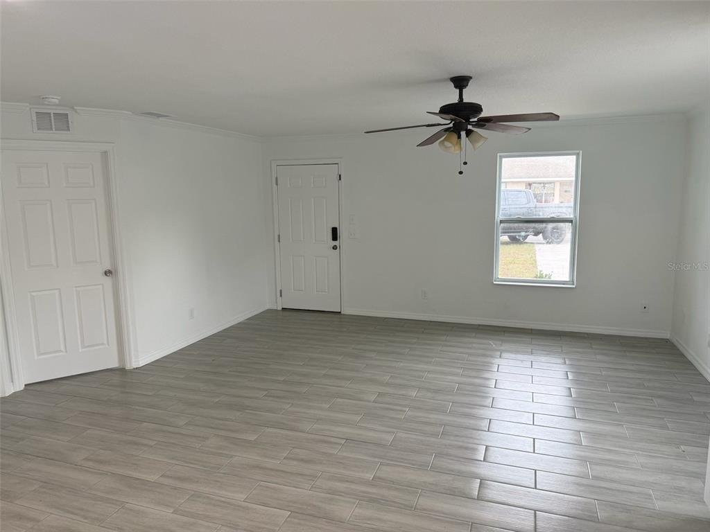 89 West Imogene Street Arcadia, FL 34266 - Photo 4 of 18 wooden floor in an empty room